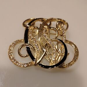 Stunning Gold and Black Swirl Brooch